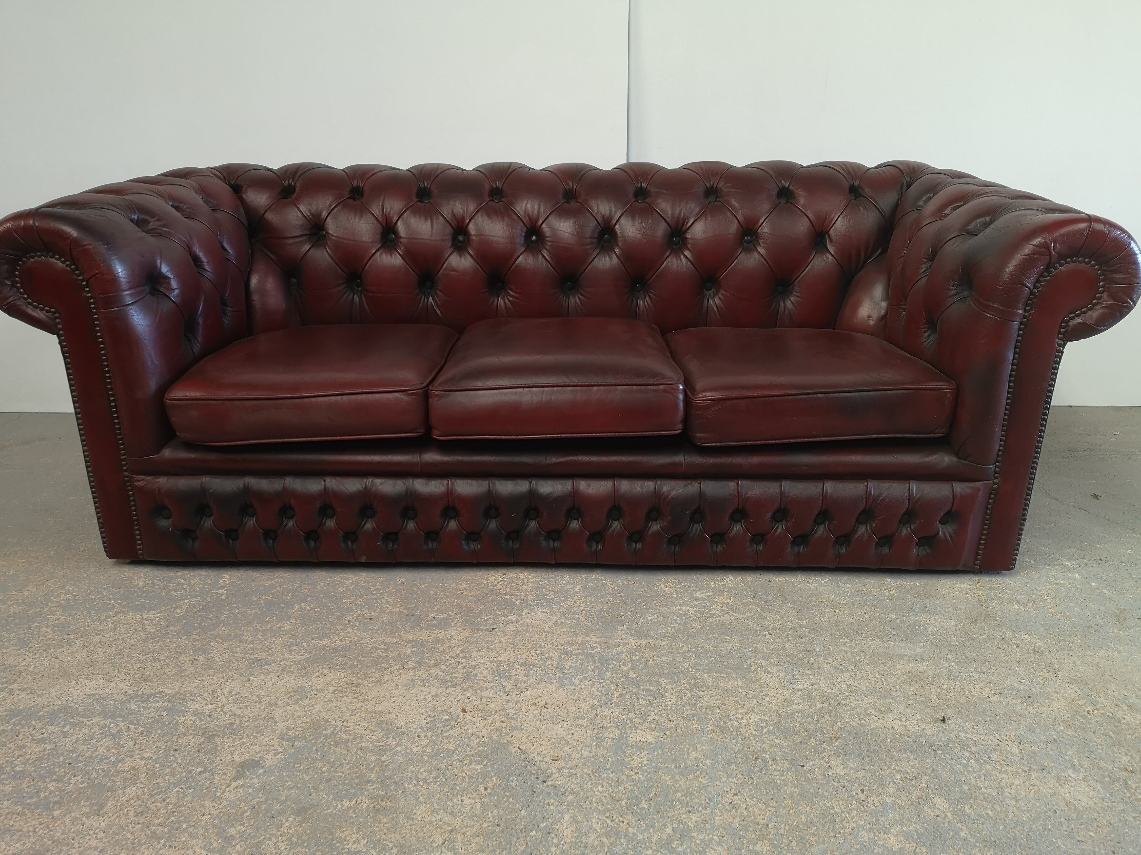 Burgundy leather chesterfield sofa