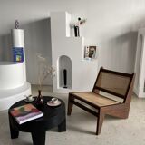 Reclined armchair in canned teak in natural wood