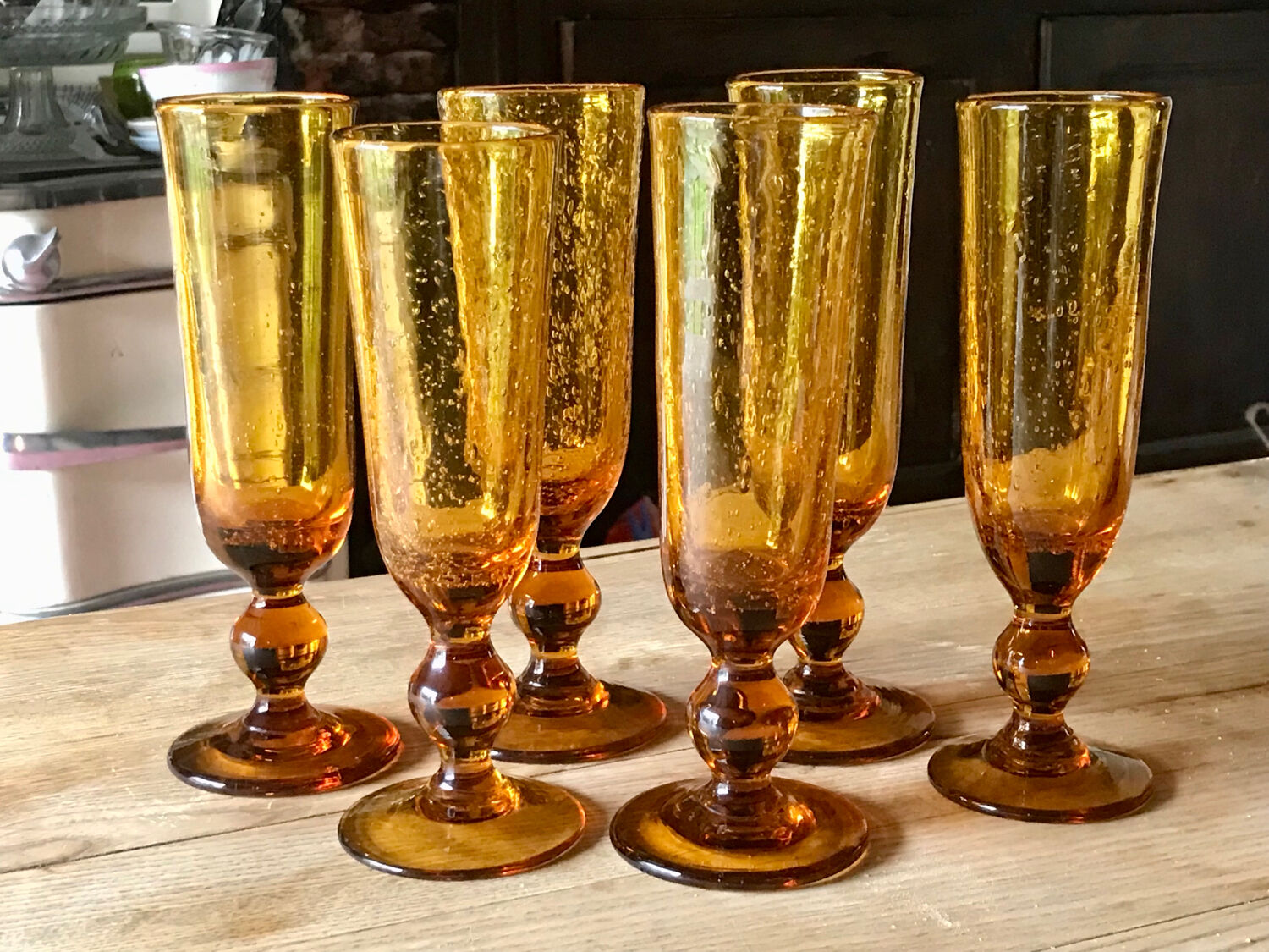 Champagne flutes bubbled amber blown