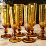 Champagne flutes bubbled amber blown