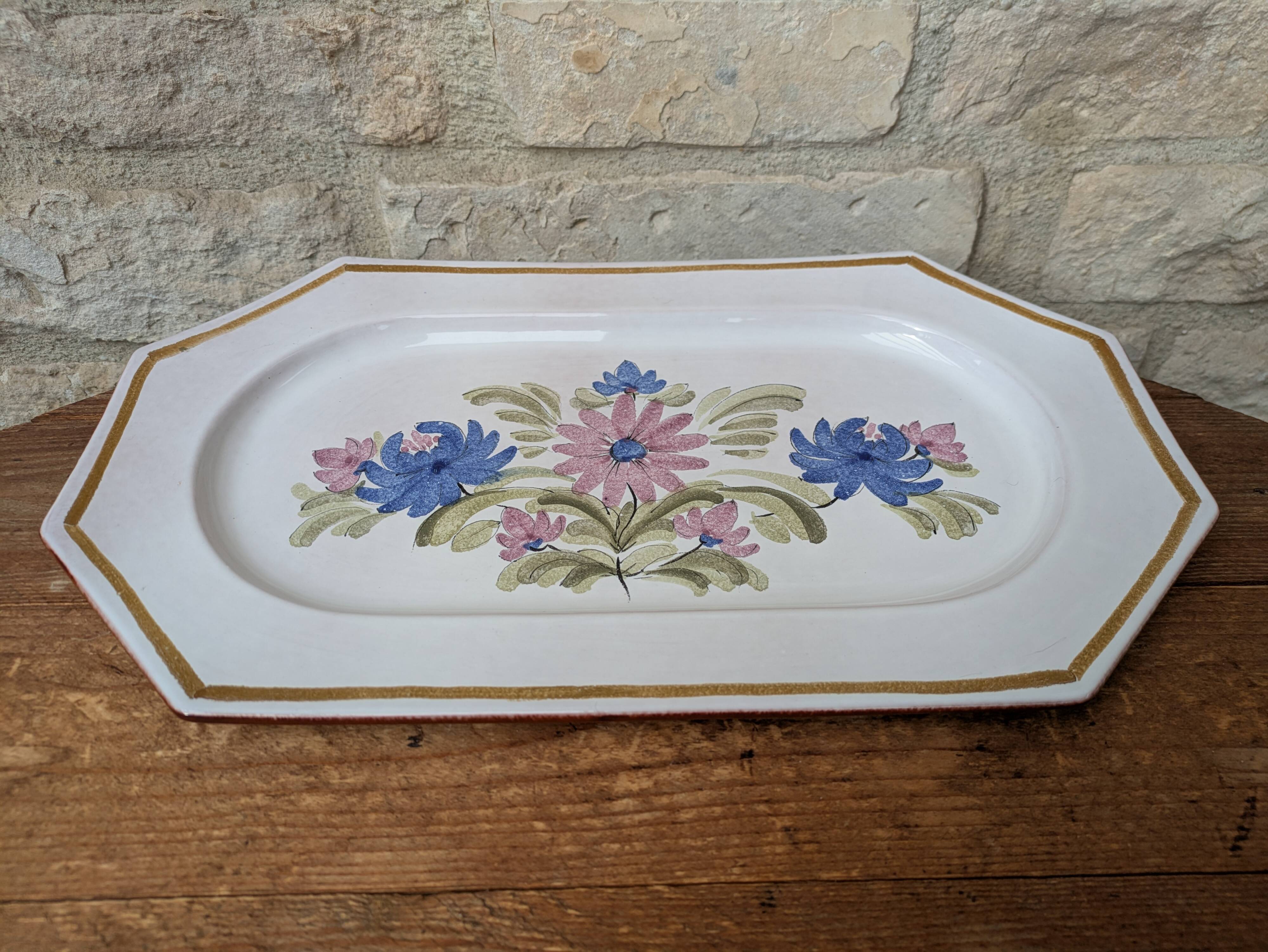 Rectangular earthenware dish with a glazed finish, decorated with a bouquet of flowers.