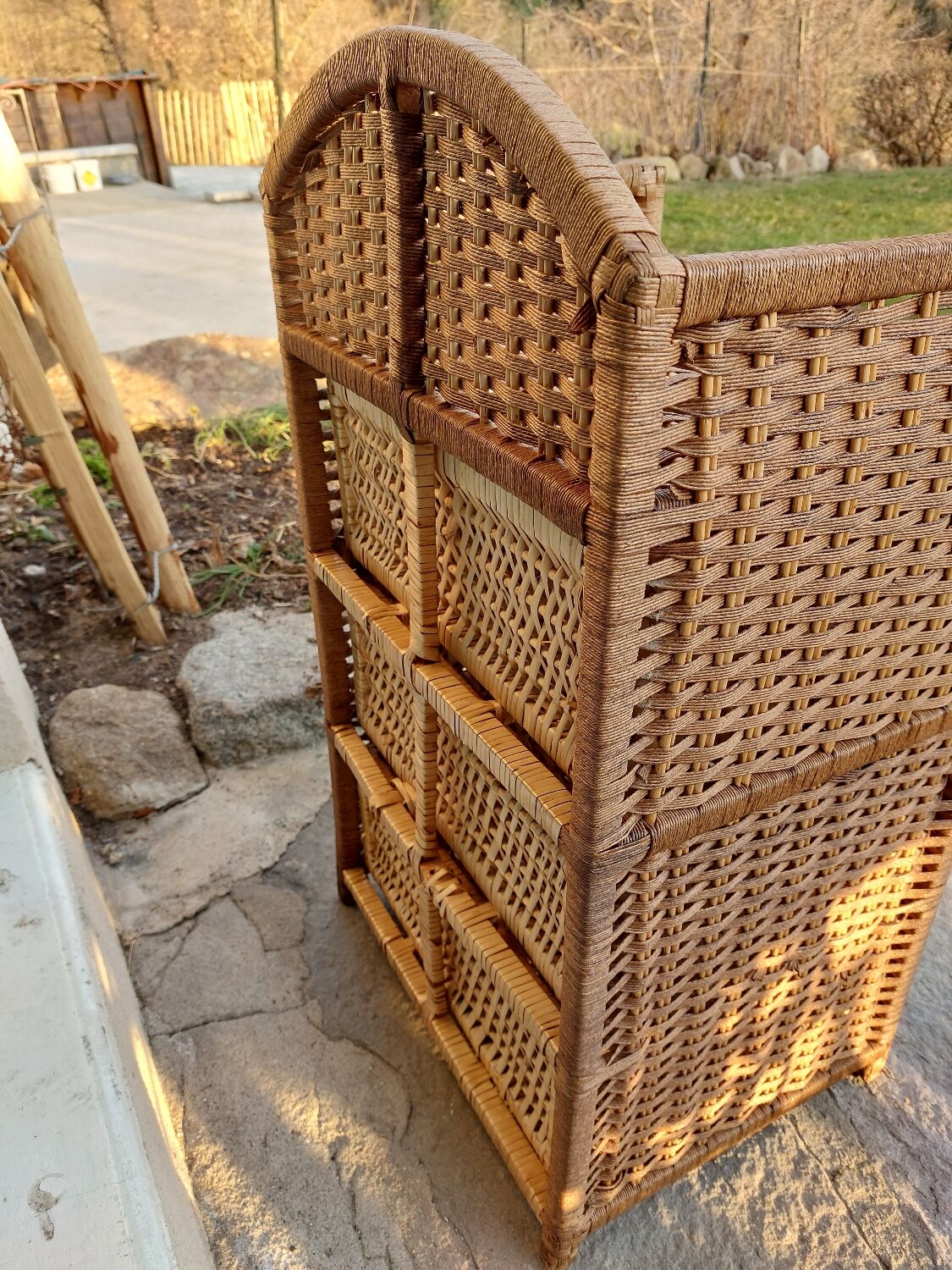 Wicker chest of drawers and rope
