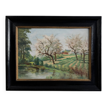 Huile sur panneau "Cours d'eau arbres en fleur", cadre en bois noirci, XXe s.