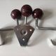 Set of 3 metal and bakelite coat hooks, public school type