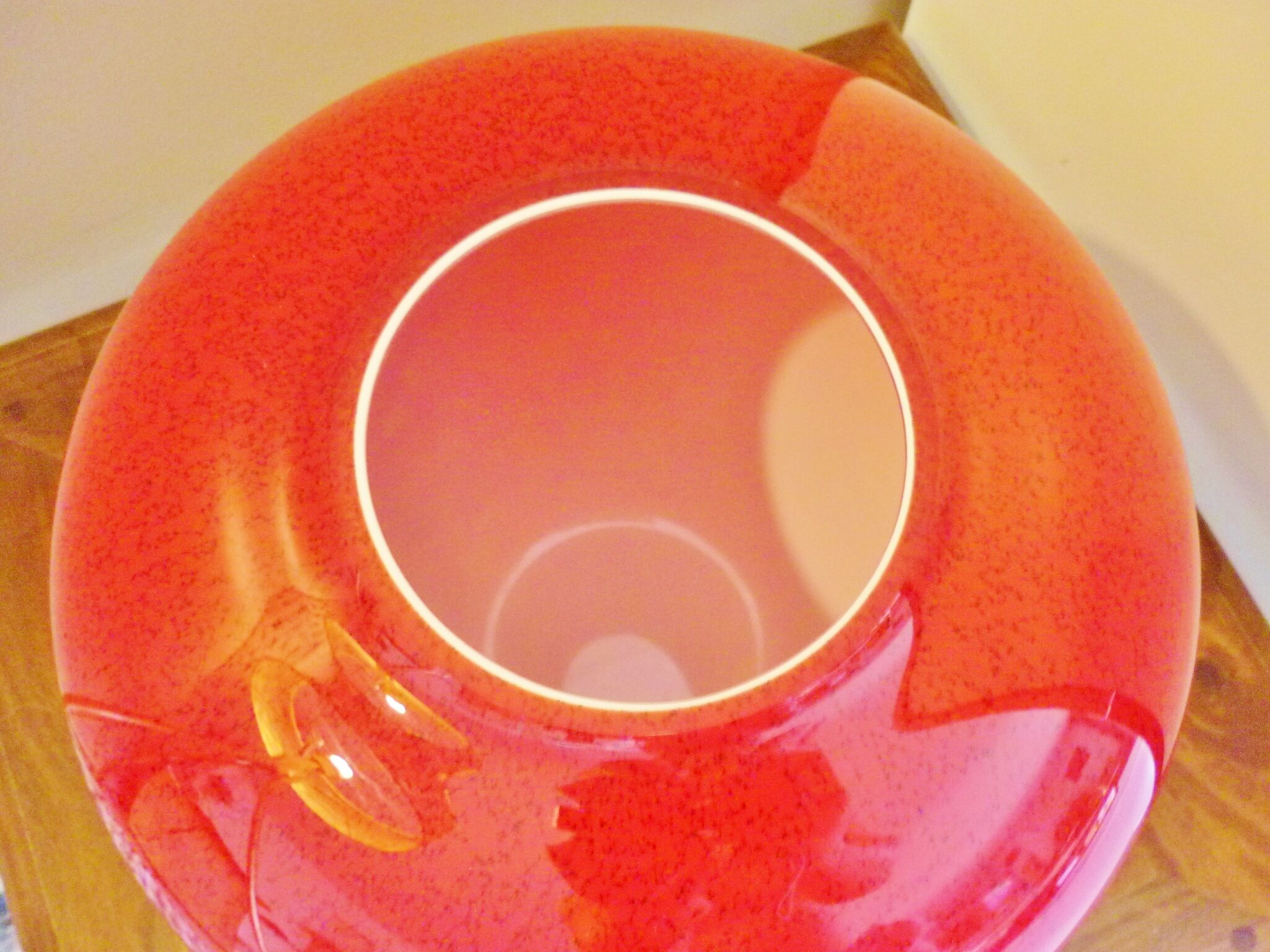Pot-bellied, art deco vase in speckled ruby red multi-layered glass, white interior