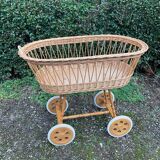 Vintage wicker cradle on casters