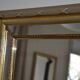 Large mirror with wooden gilded and carved frame.