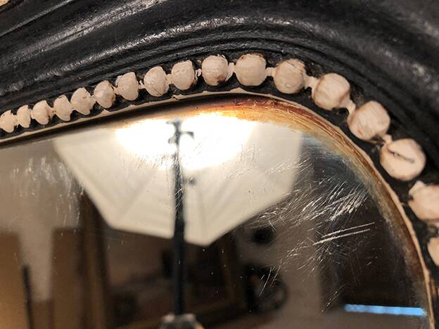 Napoleon III curved mirror, blackened wood frame with cream trim