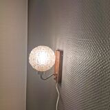 Wall light in rosewood with bobble glass ball shade.