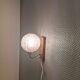 Wall light in rosewood with bobble glass ball shade.