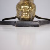 Solid brass dolphin console feet.