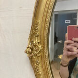 Miroir oval en bois doré 70x49cm
