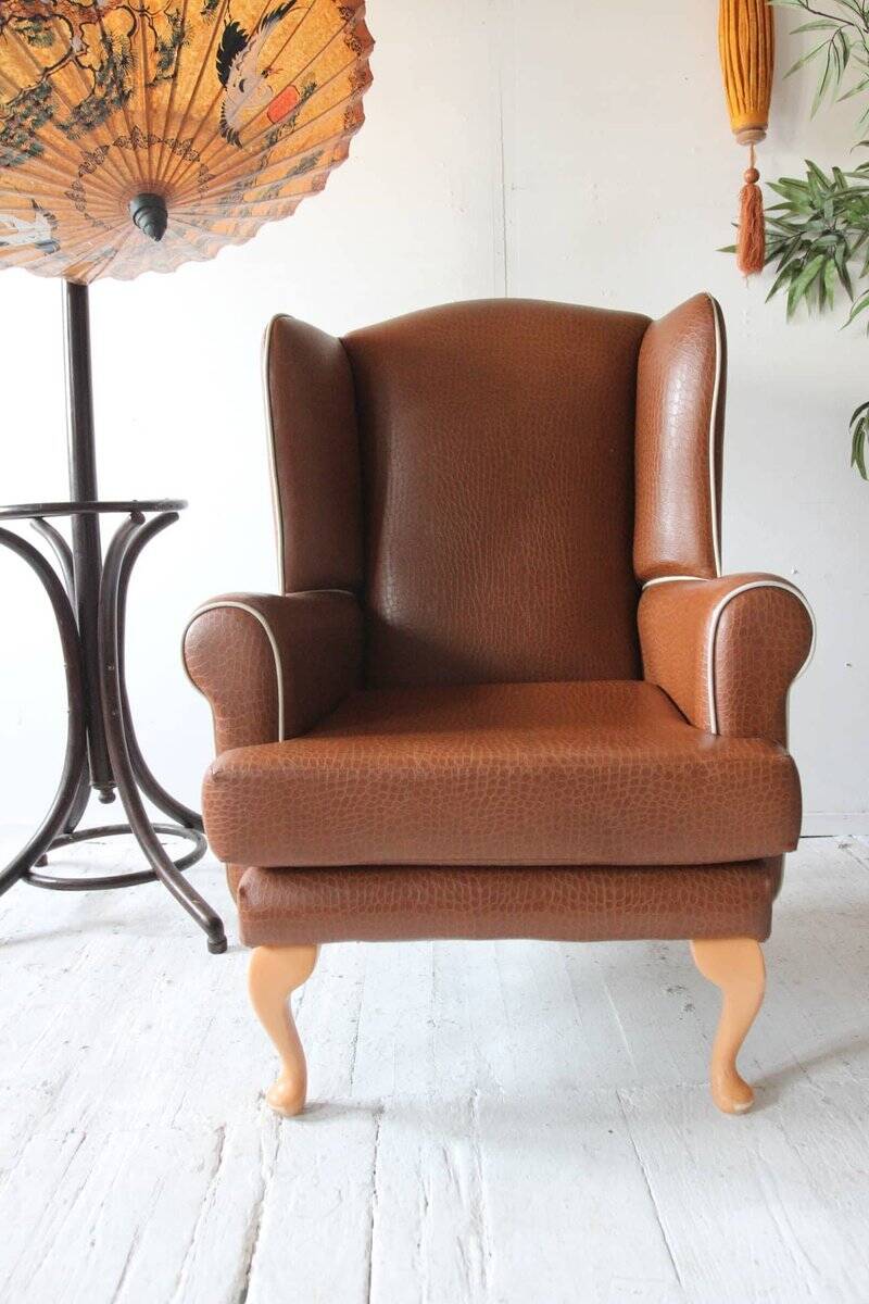 Vintage brown leatherette wingback armchair set, light wood legs, 1960s.