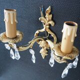 Pair of gilded bronze sconces and crystal pendants