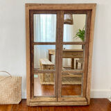 Mirror in old rustic window