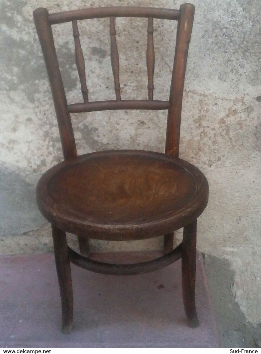 Antique children's chair in curved wood