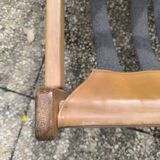 Pair of solid wood and leather lounge chairs, European work, circa 1970.