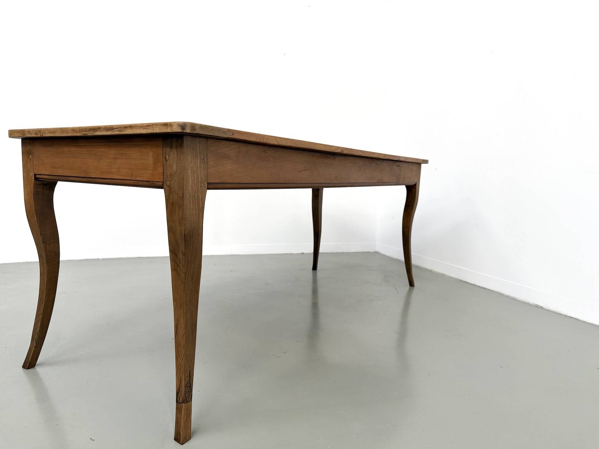 Farm table in solid cherry — Saber legs, Circa 1880