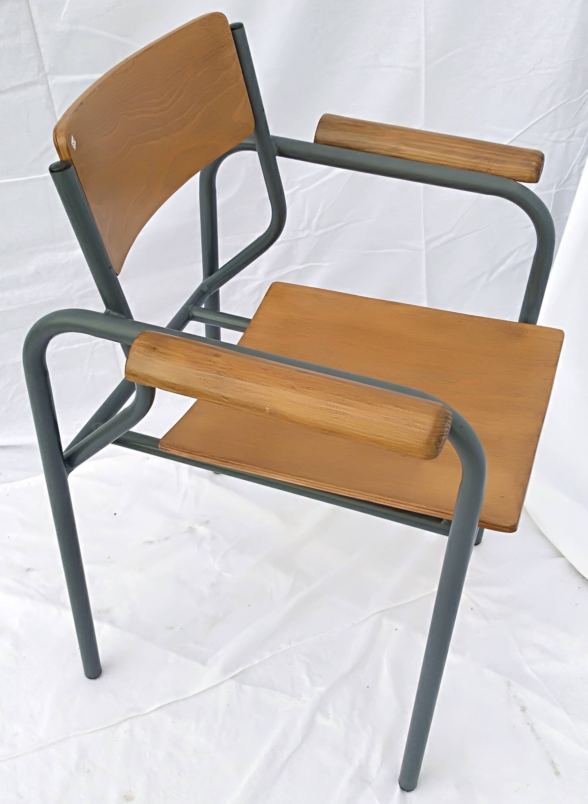 armchair tubular structure wooden seat and armrests