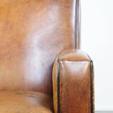 Fauteuil design en cuir de mouton vintage confortable avec un look robuste