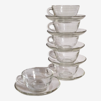 Six vintage transparent glass duralex cups and saucers
