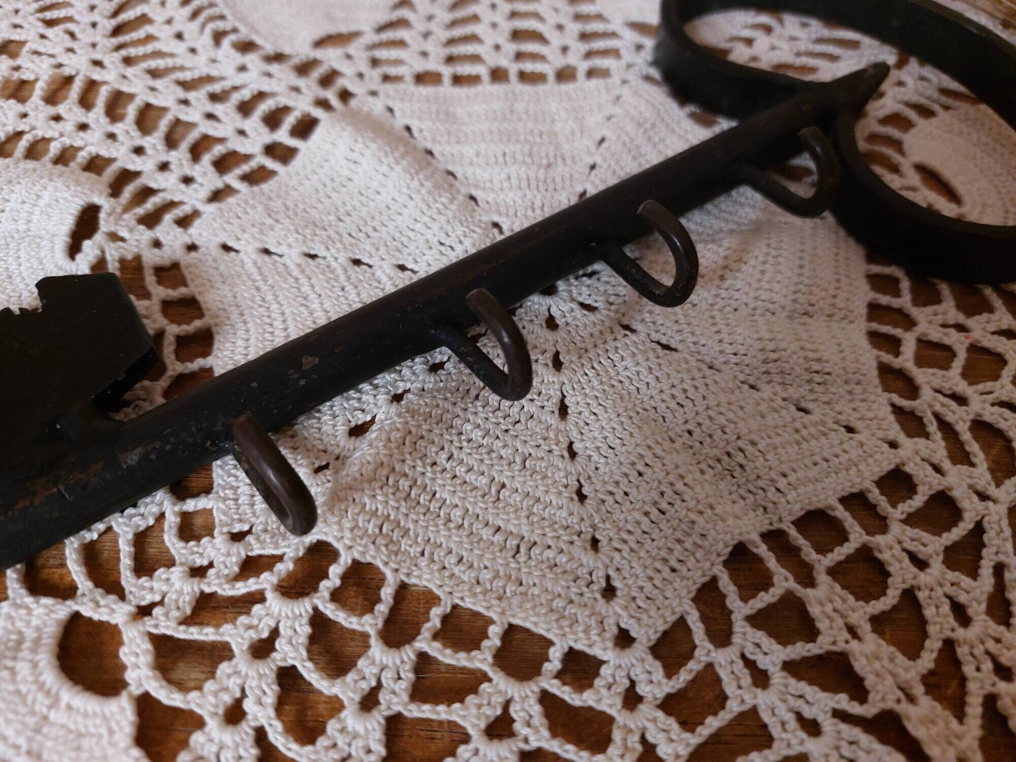 Old wall key holder in the shape of a vintage metal key 4 hooks