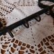 Old wall key holder in the shape of a vintage metal key 4 hooks