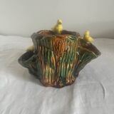 Old slipware birds on a tree trunk