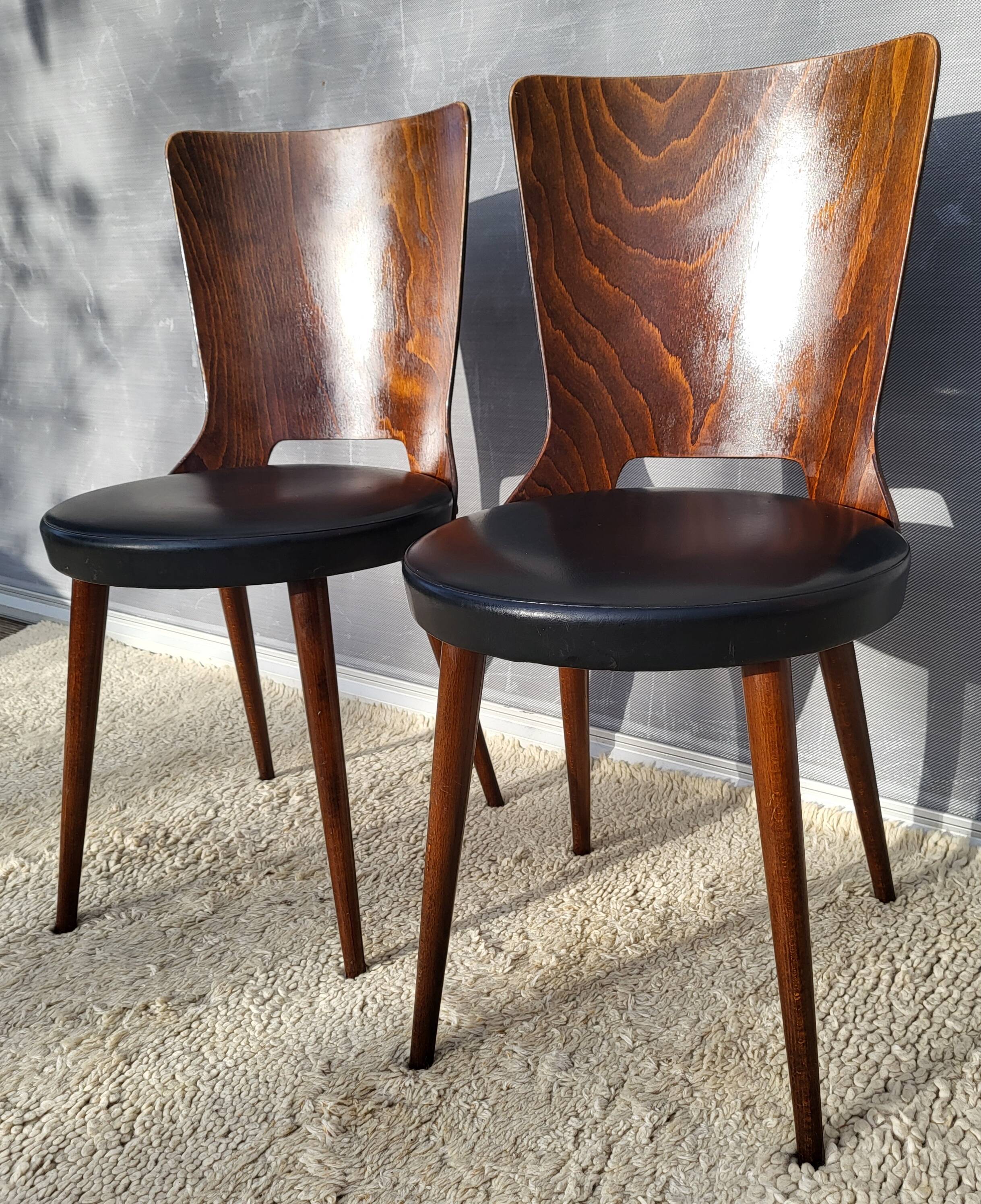 Pair of Dove chairs • Baumann • Black faux leather