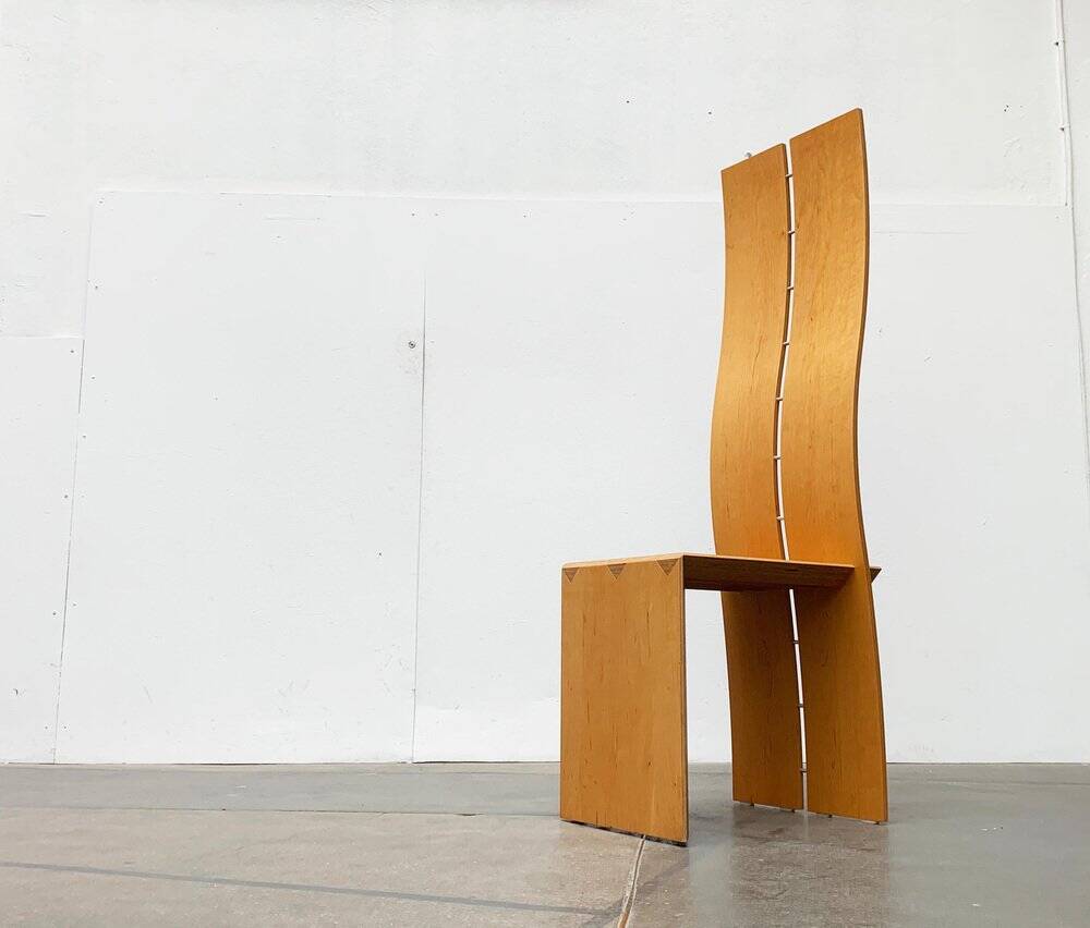 Postmodern chair with a high backrest
