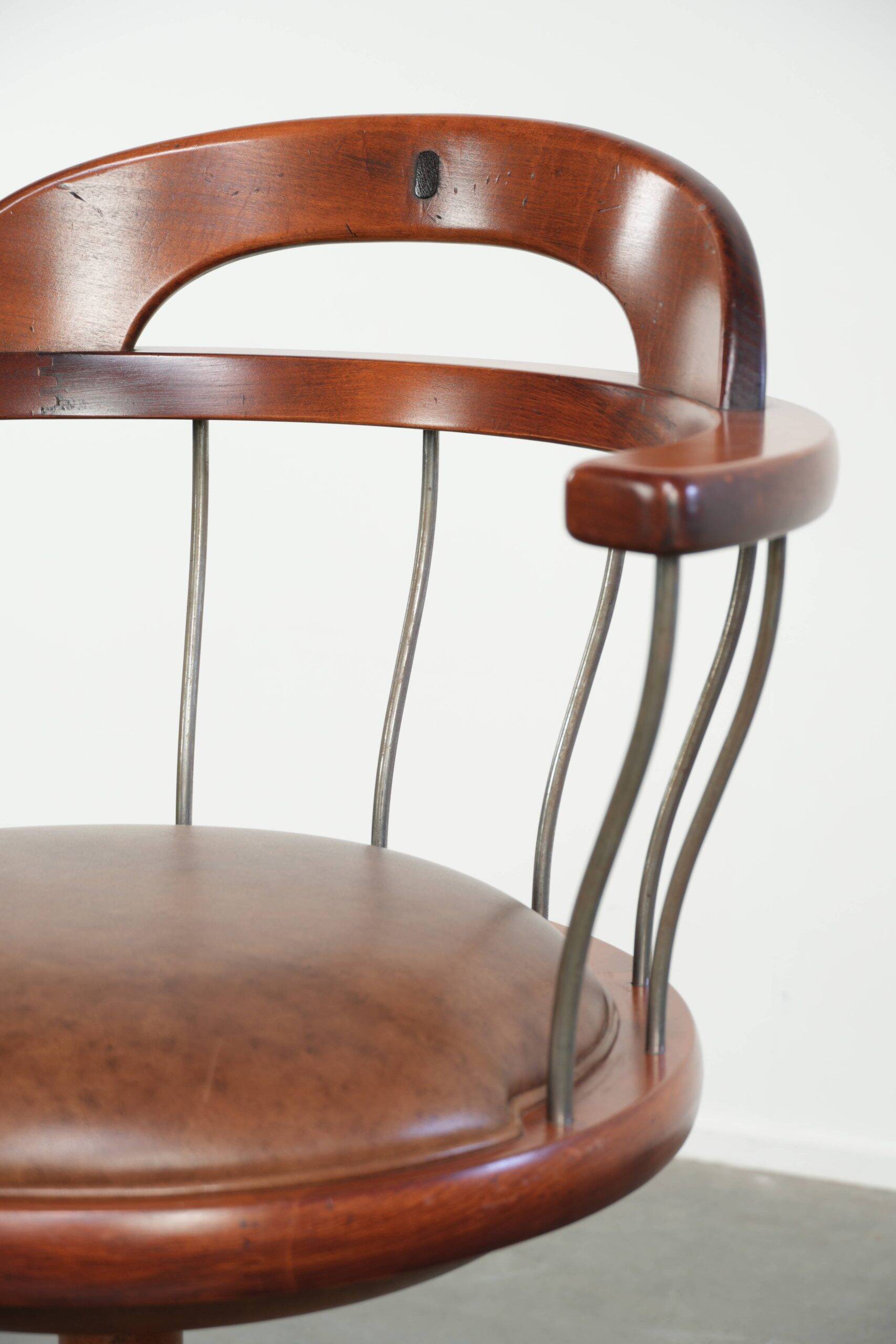 Swivel side chair / office chair with a cognac-coloured cow leather seat
