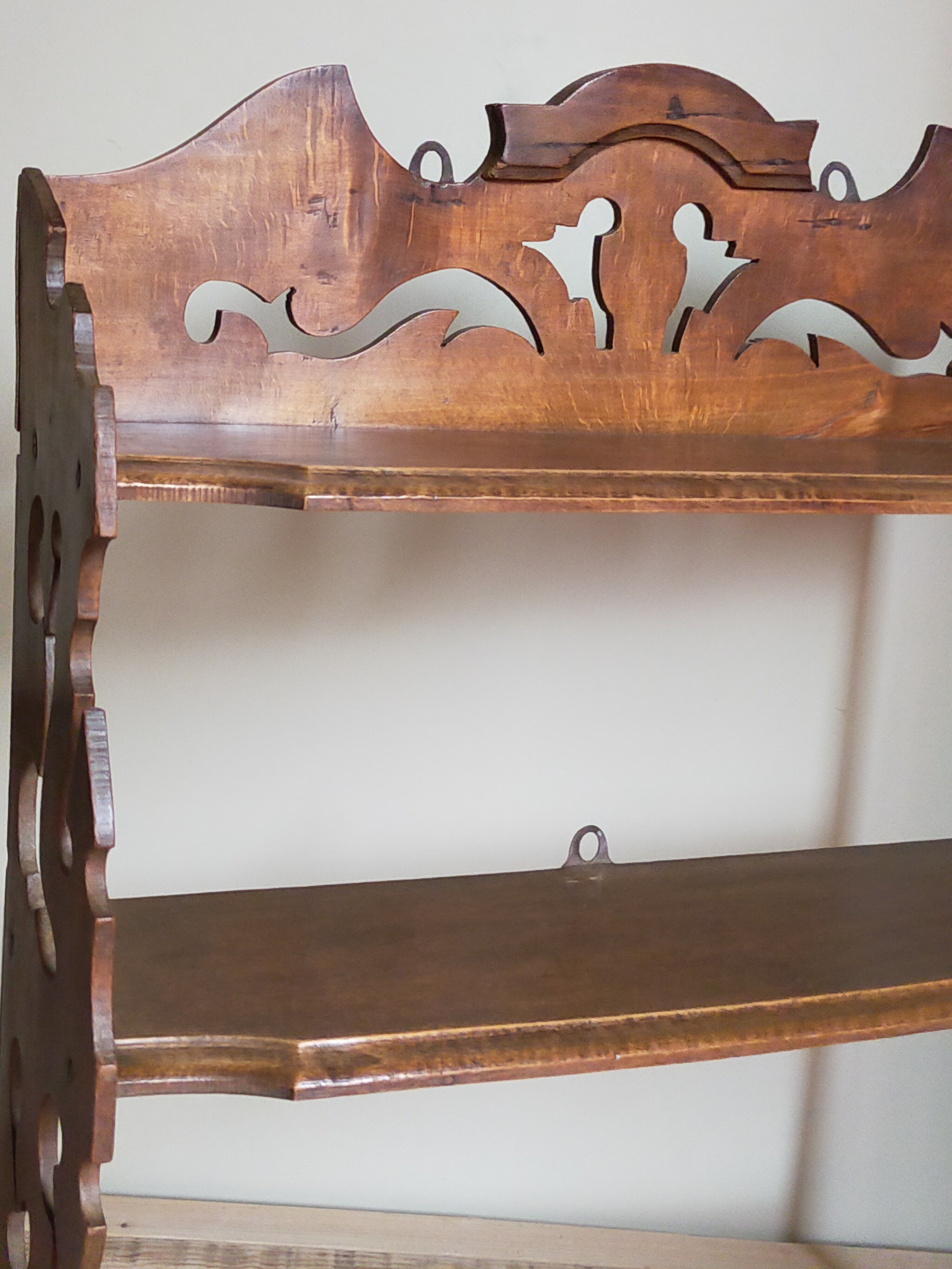 Old carved wooden wall shelf