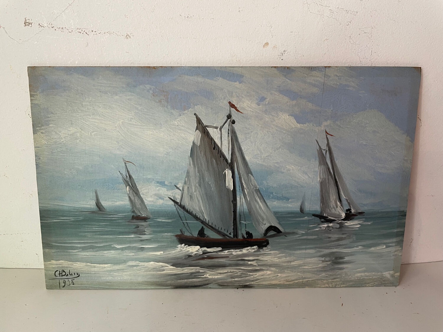 A pair of old paintings on wood.