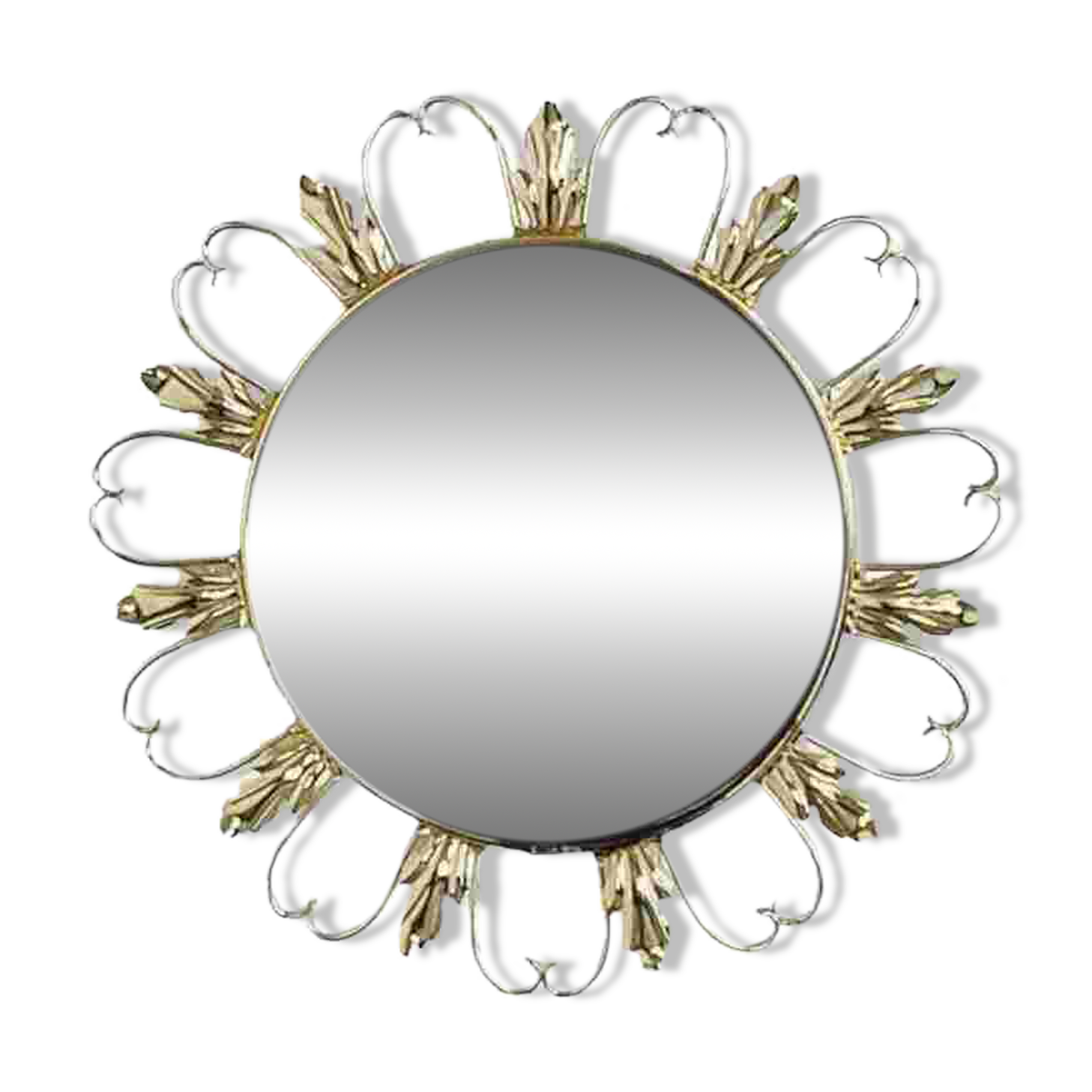 Round mirror on a brass frame with scrolls