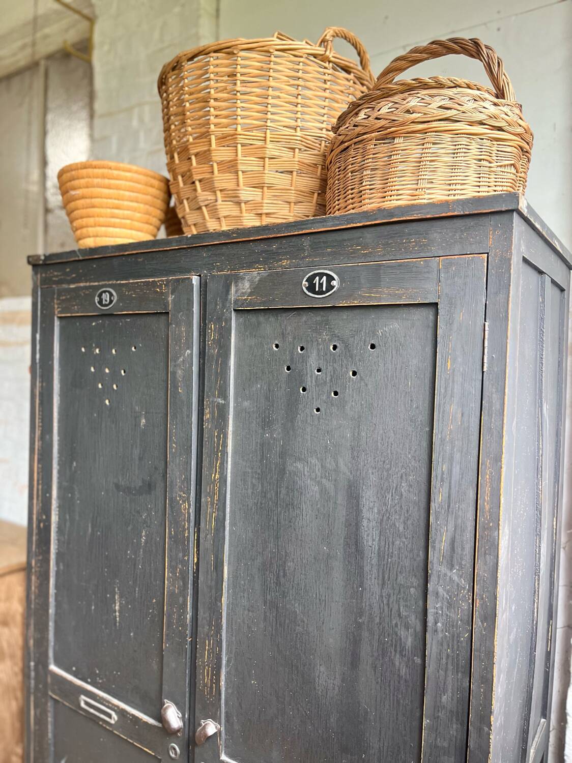Old wooden locker with black patina