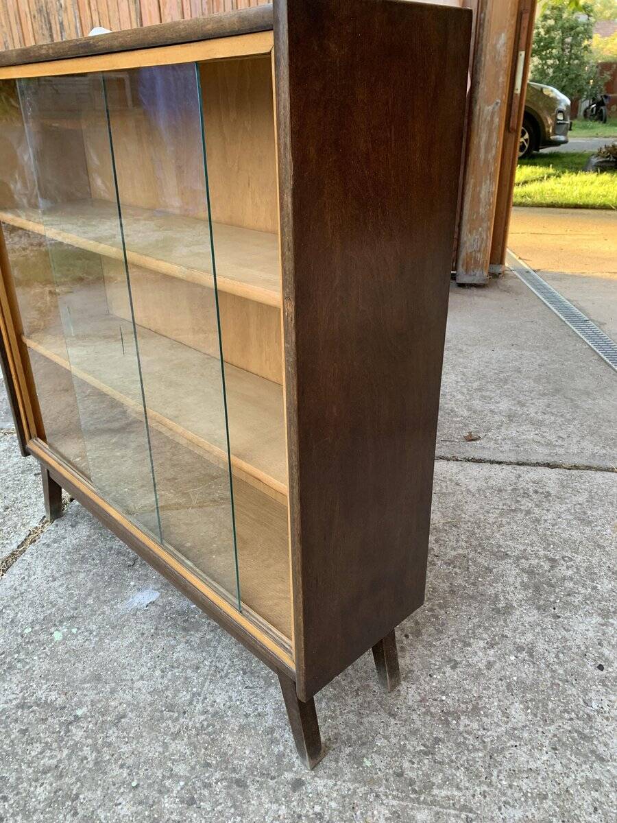 Mid-century brown wooden library (beech & pine) with glass doors from the 1960s.