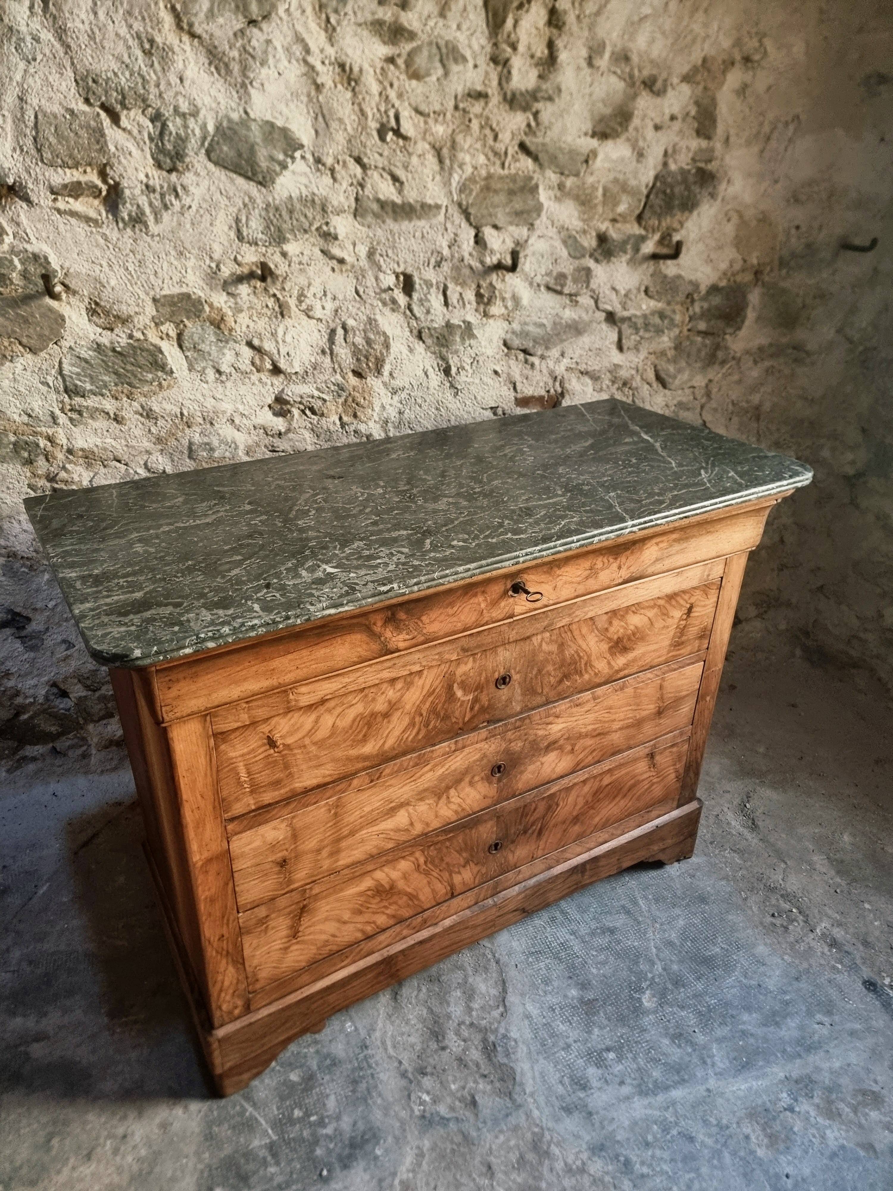 French antique walnut commode with a dark grey marble top, circa 1830–1860.