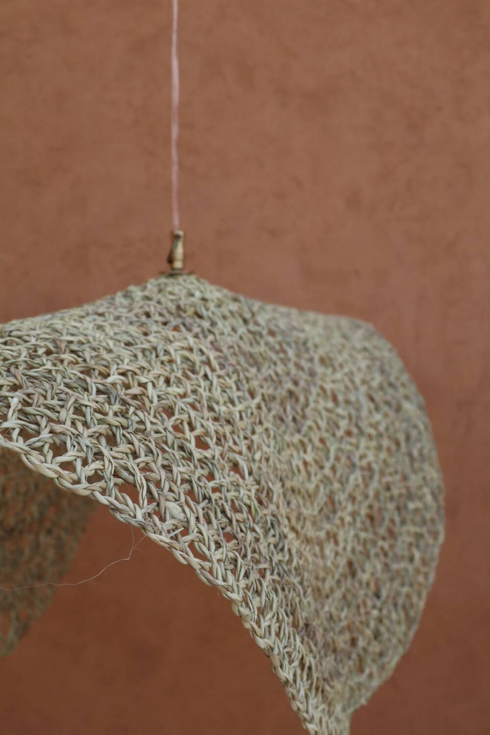 Handmade wicker hanging basket with brass finish