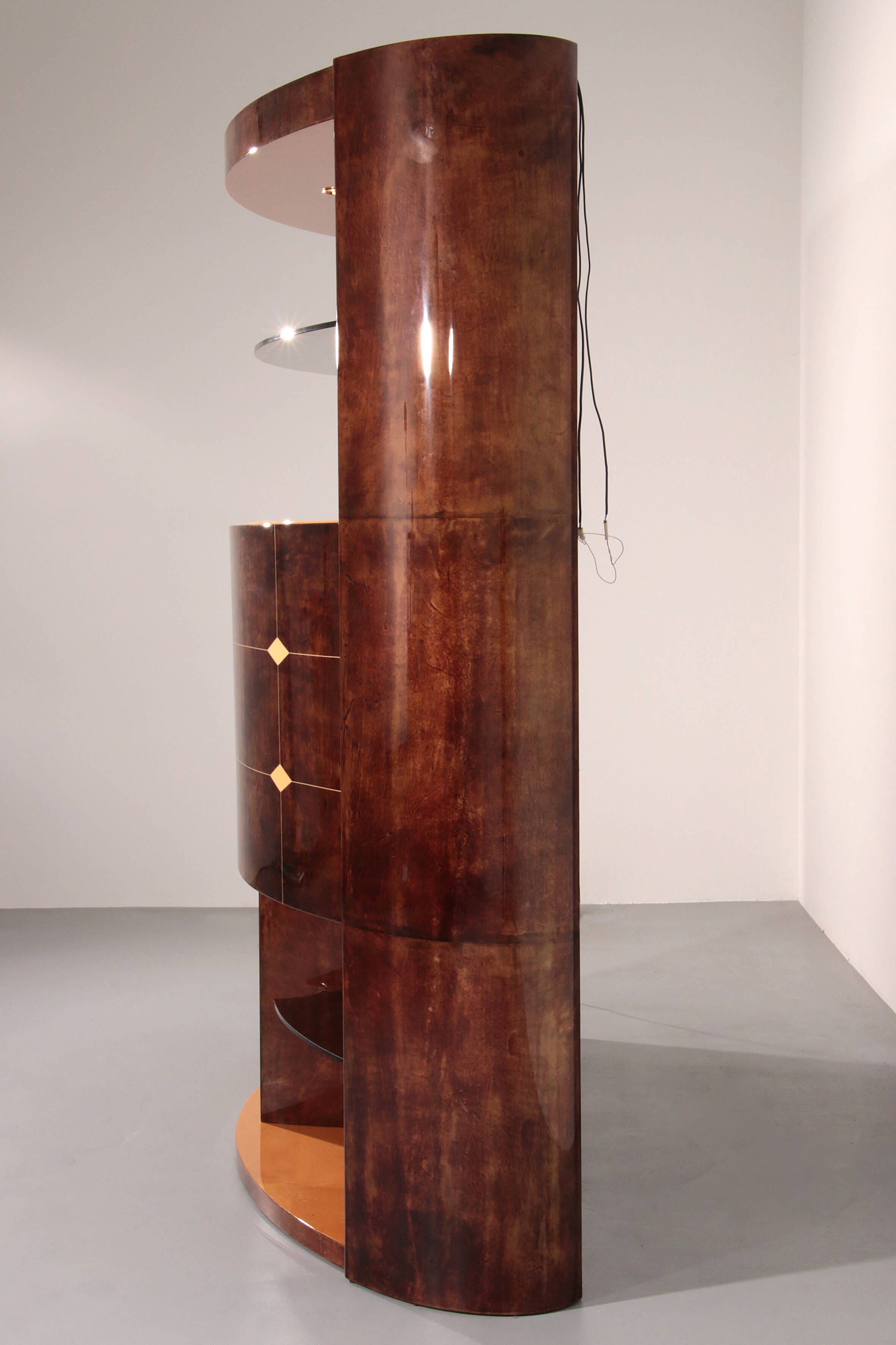 Iconic Aldo Tura brown goatskin bar cabinet with electric lift & mirror interior.