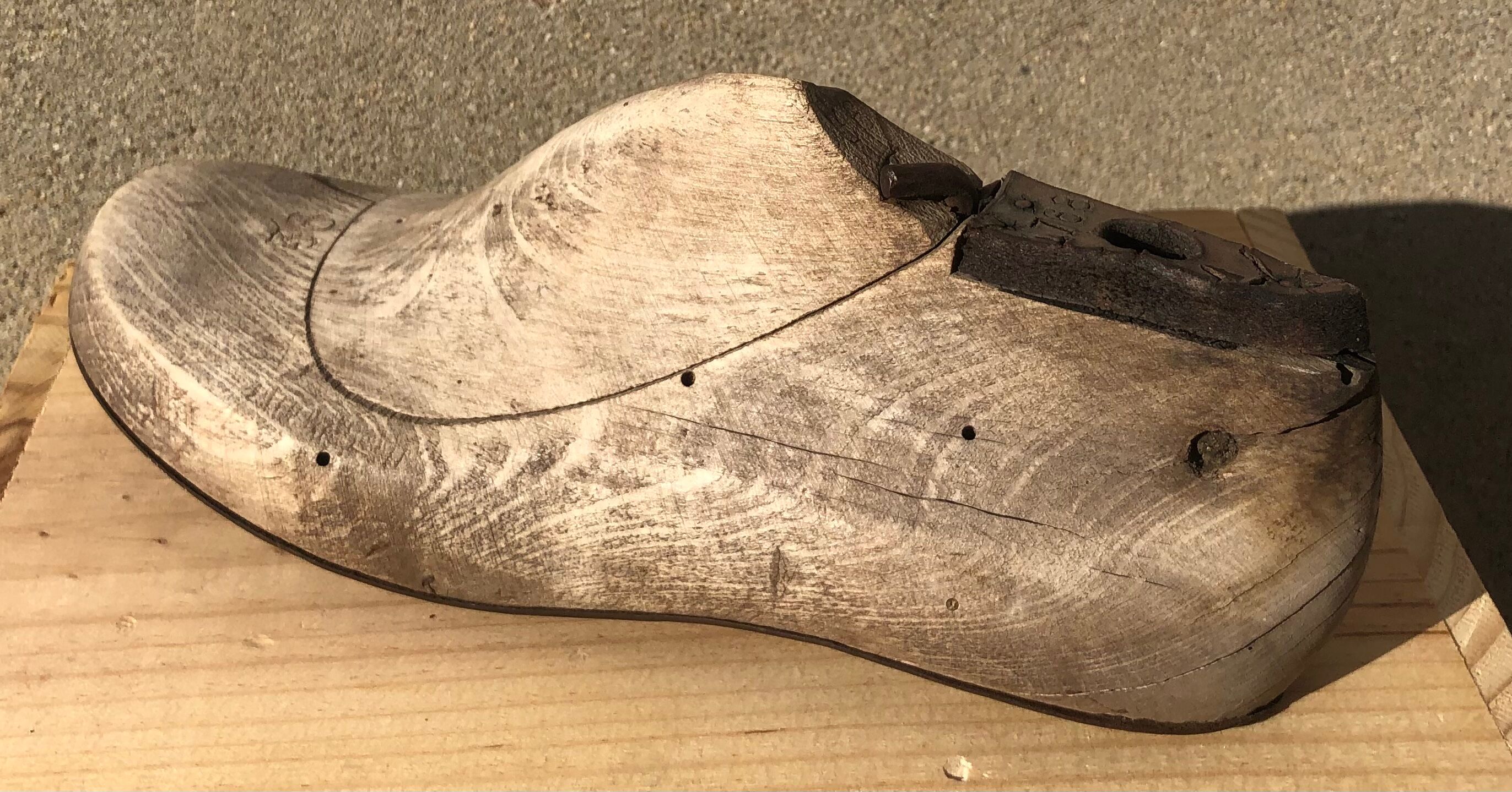 Old wooden and metal shoe tree