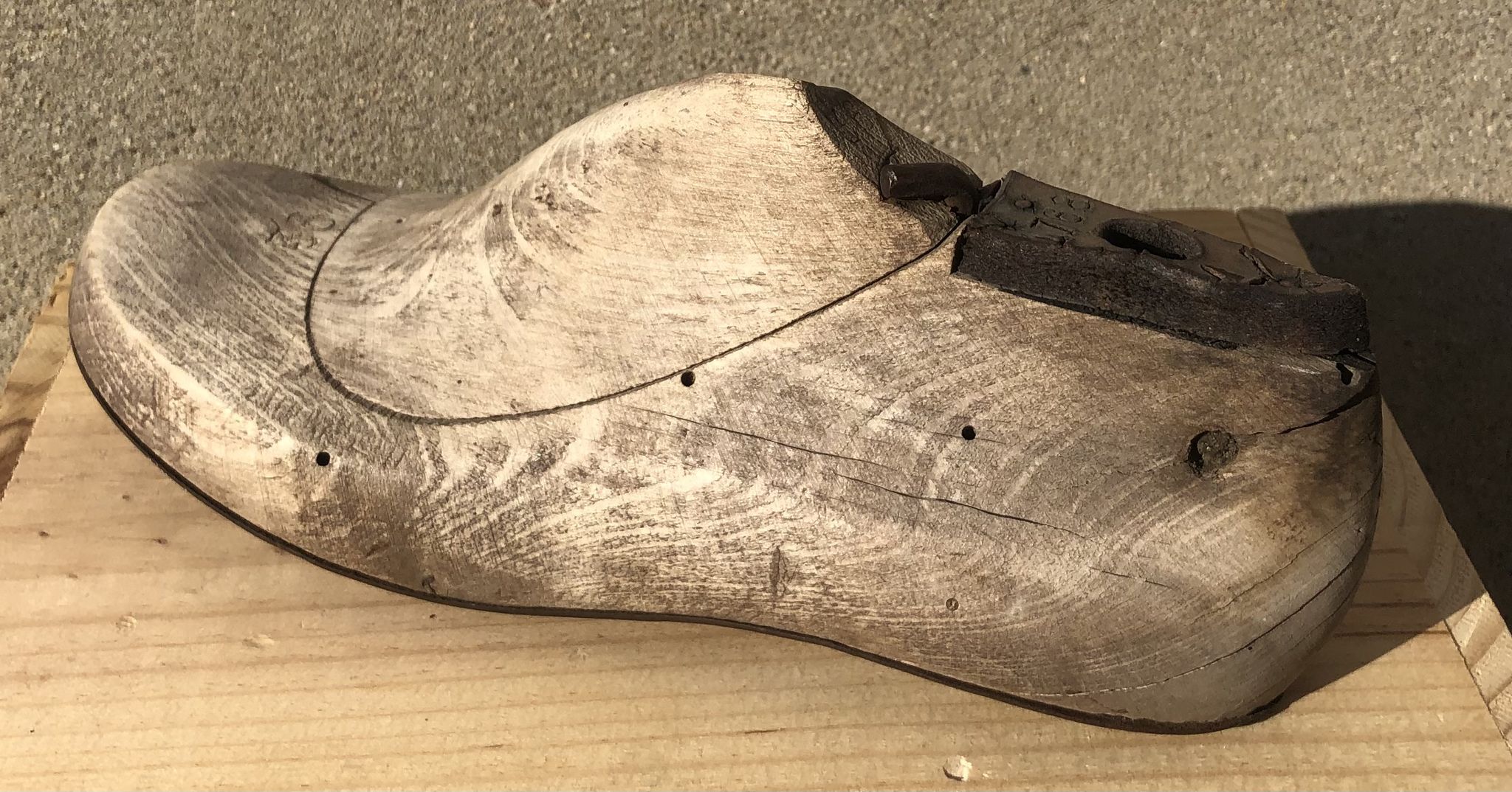 Old wooden and metal shoe tree