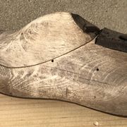 Old wooden and metal shoe tree