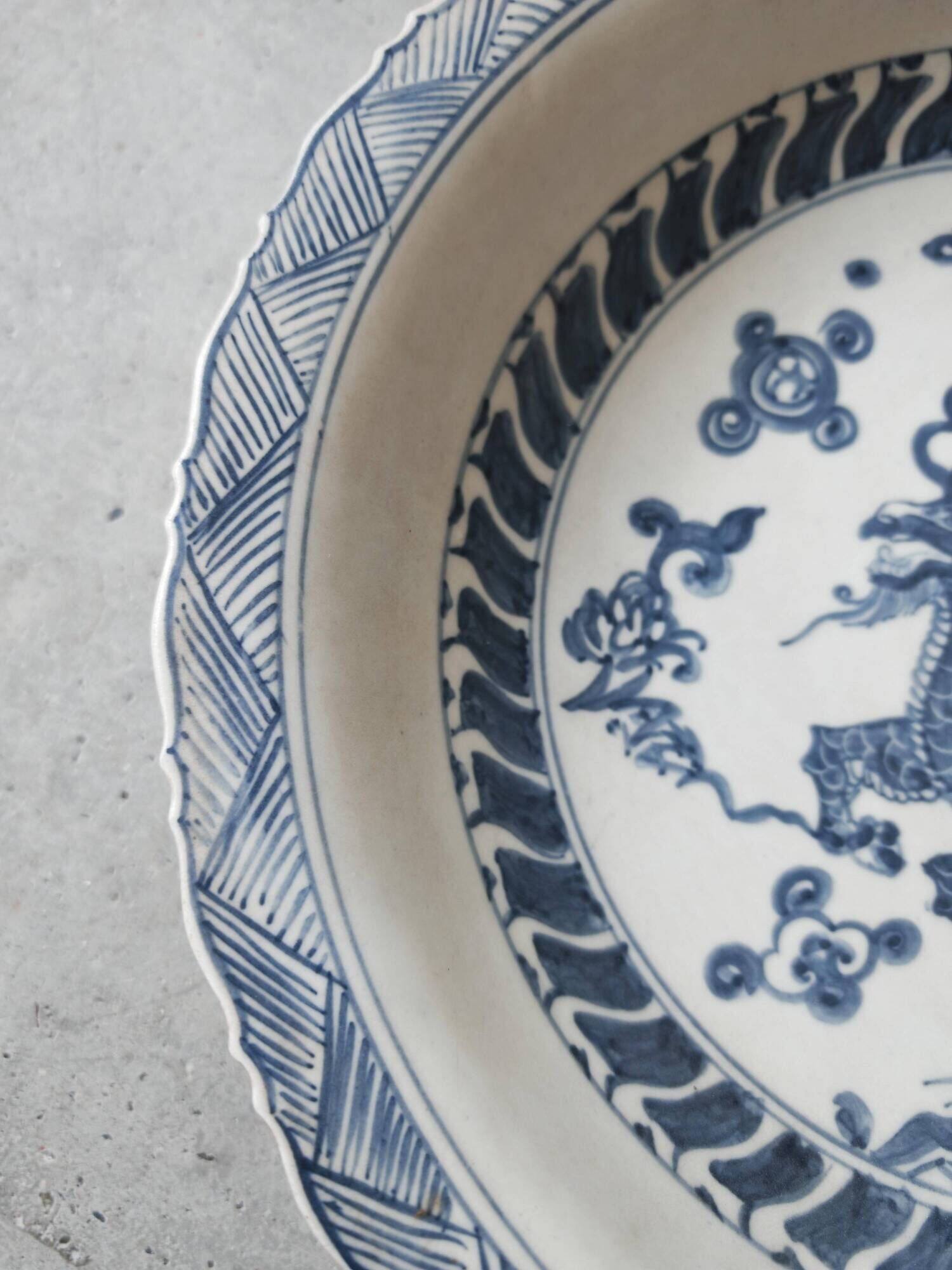 Pair of antique Chinese decorative plates with dragon motif.