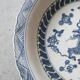 Pair of antique Chinese decorative plates with dragon motif.