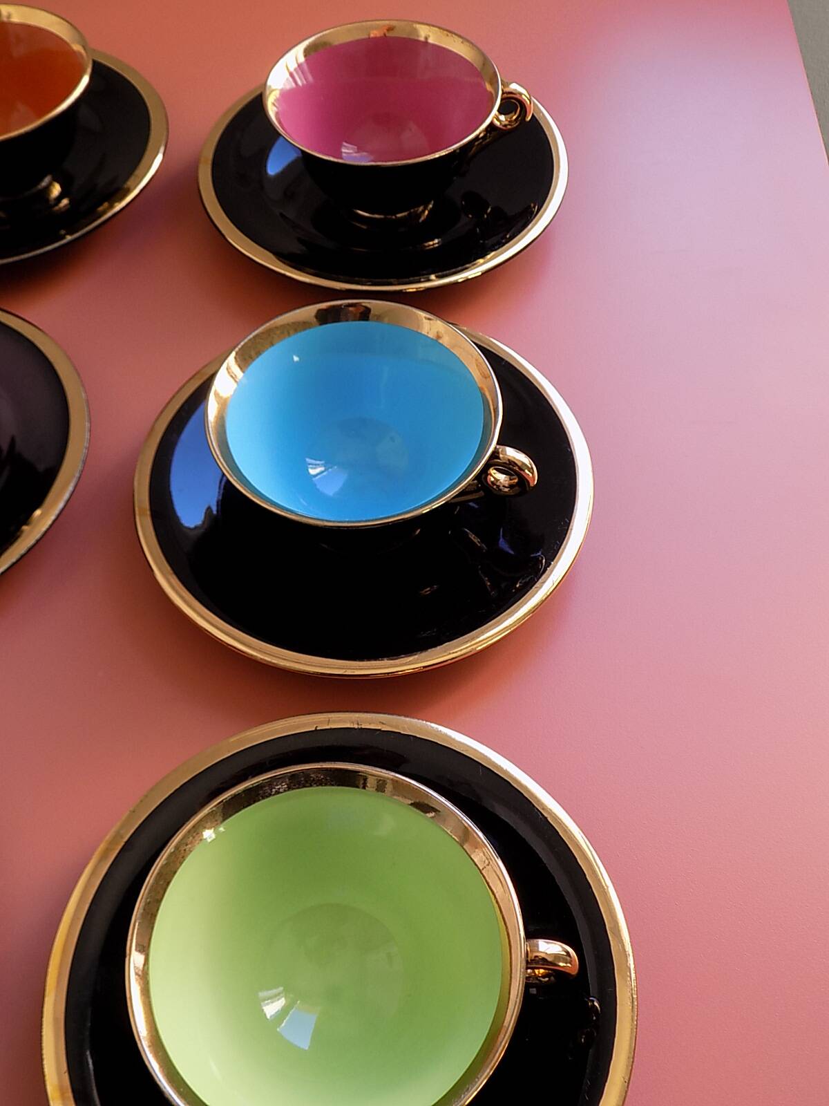 set of 9 black and gold Salins cups and saucers