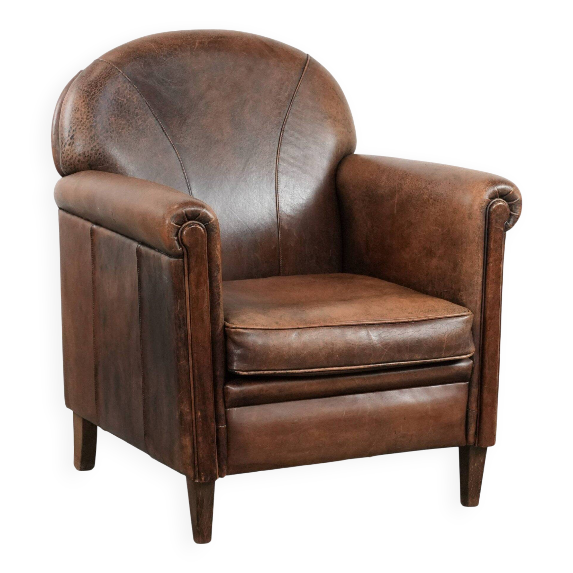 Vintage sheepskin armchair with warm colours and a characterful appearance