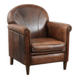 Vintage sheepskin armchair with warm colours and a characterful appearance
