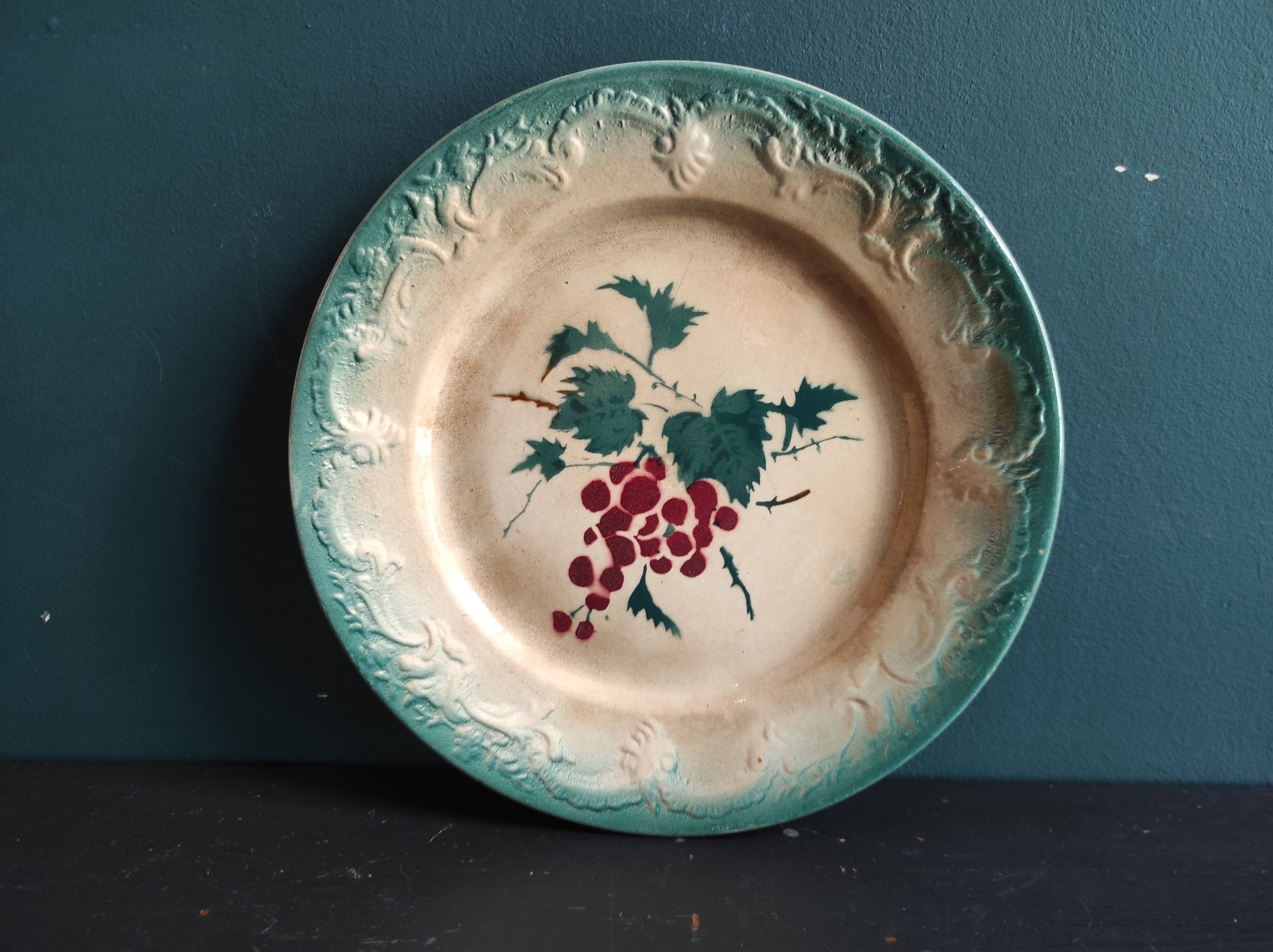 French antique barbotine plate decorated with stencil of grapes, faience de Castres