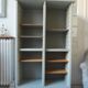 Vintage furniture transformed into a bookcase, verdigris patinated sideboard.