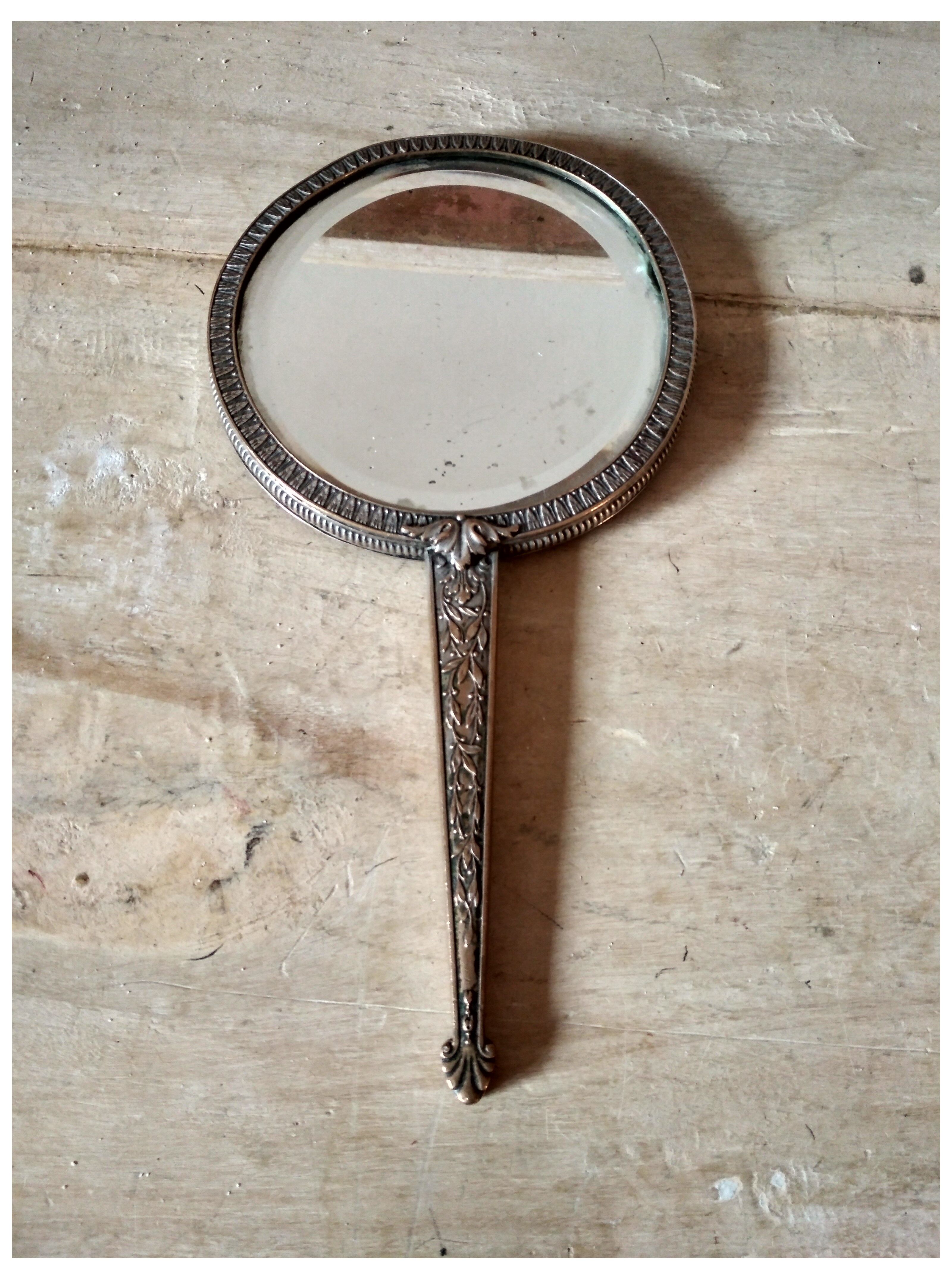 Old hand mirror beveled glass